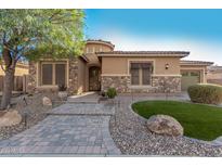 House exterior with stone accents and paver walkway at 2299 E Saddlebrook Rd, Gilbert, AZ 85298