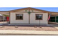 Front view of a single-wide manufactured home with a carport at 8103 E Southern Ave # 154, Mesa, AZ 85209