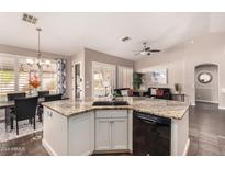Island kitchen with granite countertops and stainless steel appliances at 1785 S Nebraska St, Chandler, AZ 85286