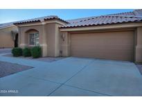 Tan garage door and walkway at a tan home at 5830 E Mckellips Rd # 8, Mesa, AZ 85215