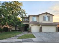 Two-story house with a three-car garage and landscaping at 4450 S Rio Dr, Chandler, AZ 85249