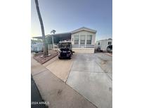 Mobile home exterior with carport and landscaping at 1541 W Yurok Ave, Apache Junction, AZ 85119