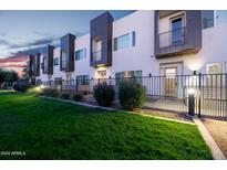 Modern townhouses with private patios and a well-manicured lawn at 5151 N 13Th Pl # 4, Phoenix, AZ 85014