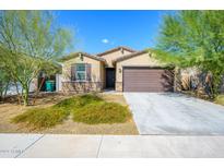 Modern single-story home with brown garage door at 12568 W Orangewood Ave, Glendale, AZ 85307