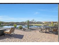 Relaxing backyard patio with pond view at 16866 S 180Th Ave, Goodyear, AZ 85338