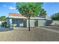 Tan stucco exterior with a gated entrance at 2416 W Caribbean Ln # 1, Phoenix, AZ 85023