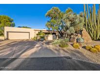 Desert landscape with two-story home and driveway at 3044 Ironwood Rd, Carefree, AZ 85377