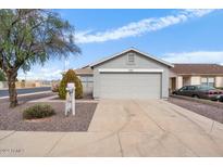 Ranch style home with gray exterior and a two-car garage at 11546 W Larkspur Rd, El Mirage, AZ 85335