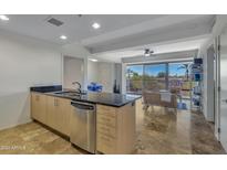 Modern kitchen featuring stainless steel appliances and granite countertops at 7121 E Rancho Vista Dr # 4004, Scottsdale, AZ 85251