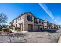 Townhouse exterior showcasing attractive architectural details and landscaping at 1265 S Aaron -- # 236, Mesa, AZ 85209