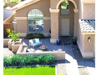 Relaxing front patio with seating area, fire pit, and landscaping at 7243 E Nopal Ave, Mesa, AZ 85209