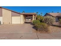 House exterior, front view with attached garage and carport at 2029 S Las Palmas --, Mesa, AZ 85202