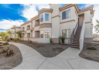 Two-story condo building with landscaped grounds and walkways at 1941 S Pierpont Dr # 2028, Mesa, AZ 85206