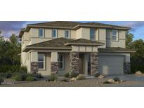 Two-story house with stone accents and a three-car garage at 20578 E Via De Colina --, Queen Creek, AZ 85142