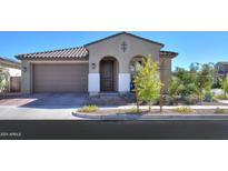 Single story home with a two-car garage and desert landscaping at 9515 E Rainbow Ave, Mesa, AZ 85212