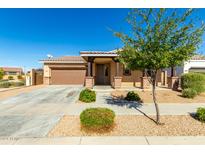 Single story home with covered porch and two car garage at 22510 E Via Las Brisas --, Queen Creek, AZ 85142