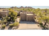 Desert landscape setting with two-car garage and private driveway at 9252 E Whitethorn Cir, Scottsdale, AZ 85266