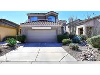 Two-story home with a two-car garage and drought-tolerant landscaping at 4321 E Desert Sky Ct, Cave Creek, AZ 85331
