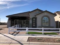 Model home showcasing modern design and curb appeal at 9963 W Cora Ln, Avondale, AZ 85392