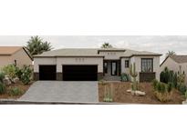 Stunning curb appeal with three-car garage and desert landscaping at 15522 E Chicory Dr, Fountain Hills, AZ 85268
