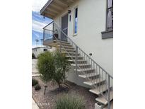 Exterior view featuring a staircase leading to a condo entrance with balcony at 14415 N Boxwood Ln # D, Fountain Hills, AZ 85268