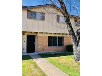 Brick two-story townhome with a private entrance and yard at 6742 N 43Rd Ave, Glendale, AZ 85301