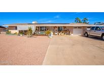House exterior with driveway and landscaping at 930 E Friar Ave, Apache Junction, AZ 85119