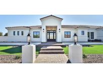 Stunning curb appeal, featuring a modern white exterior and landscaped lawn at 2041 N Orchard --, Mesa, AZ 85213