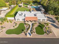 Luxury home with pool, expansive lawn, and detached garage at 491 N 159Th Pl, Gilbert, AZ 85234