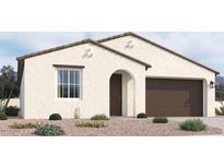 One-story home with brown garage door and desert landscaping at 37600 N Cowboy Ln, San Tan Valley, AZ 85140
