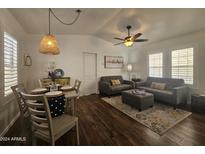Open living and dining area with hardwood floors and modern decor at 8700 E University Dr # 2020, Mesa, AZ 85207