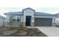 One-story home with gray exterior, stone accents, and a two-car garage at 48466 N Duran Way, Gold Canyon, AZ 85118
