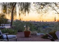 Stunning sunset view of city skyline from the backyard patio at 4549 E Marion Way, Phoenix, AZ 85018