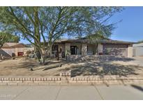 Single-story home with landscaped yard and desert landscaping at 12846 N 45Th Ave, Glendale, AZ 85304