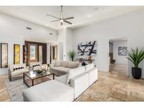 Spacious living room with light flooring and comfortable seating at 11142 E Mark Ln, Scottsdale, AZ 85262