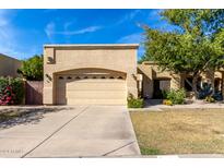Tan colored house with a two car garage at 5505 E Mclellan Rd # 9, Mesa, AZ 85205