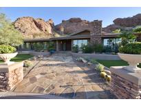 Stunning home exterior with mountain views and stone walkway at 5123 E Mcdonald Dr, Paradise Valley, AZ 85253