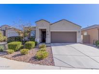 Single story home with 2 car garage and well maintained landscaping at 2653 N Wrigley Dr, Florence, AZ 85132