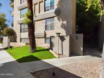 Exterior of a condo building with landscaping at 5124 N 31St Pl # 522, Phoenix, AZ 85016