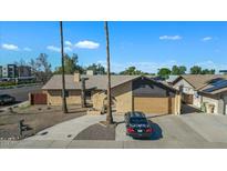 Single-story home with a two-car garage and a large yard at 15402 N 56Th Ave, Glendale, AZ 85306