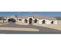 Luxury home with large driveway and arched entryway at 0 W Kayenta Trl, Laveen, AZ 85339