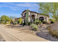 Two-story house with desert landscaping, three-car garage, and a walkway to the entry at 15439 E Acacia Way, Fountain Hills, AZ 85268