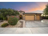 Two-story home with three-car garage and desert landscaping at 2378 N 158Th Dr, Goodyear, AZ 85395