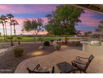 Relaxing patio with seating area and stunning sunset views at 2606 N 159Th Dr, Goodyear, AZ 85395