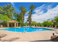 Community pool with ample lounge chairs and a shaded gazebo at 4925 E Desert Cove Ave # 350, Scottsdale, AZ 85254