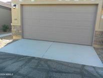 Attached two-car garage with concrete driveway at 846 N Pueblo Dr # 138, Casa Grande, AZ 85122