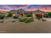 Single-story home exterior with desert landscaping at 19562 N Wikieup Ct, Surprise, AZ 85374