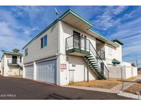 Two-story building with attached garage and external staircase at 2132 W Glenrosa Ave # 81D, Phoenix, AZ 85015