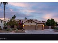 Beautiful desert home with landscaped front yard, two-car garage, and welcoming entryway at 851 N Pineview Dr, Chandler, AZ 85226