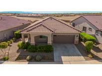 Single-story home with a two-car garage and landscaped front yard at 20403 W Calle Encorvada --, Buckeye, AZ 85396